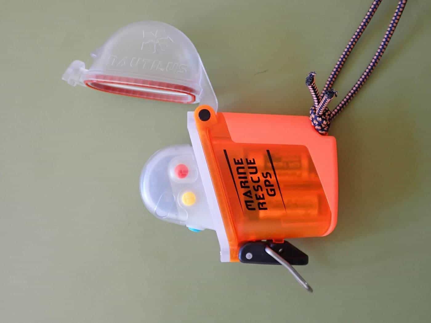A small orange personal locator beacon