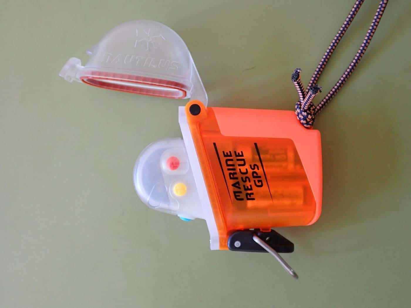 A small orange personal locator beacon